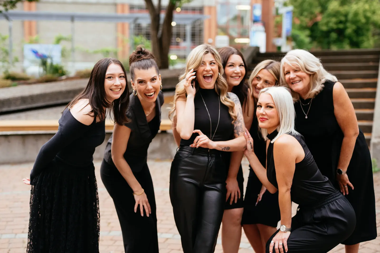 The Guisachan Esthetics Salon team smiling together while answering a client call